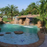 Custom Grottos, Waterfalls and Faux Rock Swimming Pools by Sammet Pools in South Florida covering Dade, Broward & Palm Beach Counties